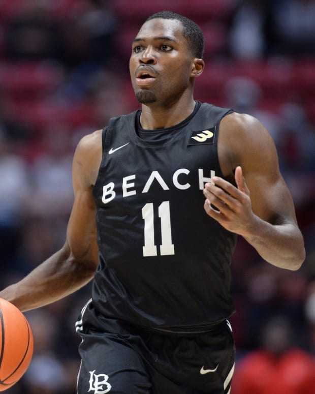 Nov 30, 2021; San Diego, California, USA; Long Beach State Beach guard Joel Murray (11) dribbles the ball during the second half against the San Diego State Aztecs at Viejas Arena. Mandatory Credit: Orlando Ramirez-USA TODAY Sports