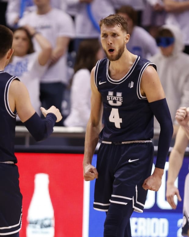 Dec 8, 2021; Provo, Utah, USA; Utah State Aggies forward Brandon Horvath (4) reacts in the second half against the Brigham Young Cougars at Marriott Center. Mandatory Credit: Jeffrey Swinger-USA TODAY Sports