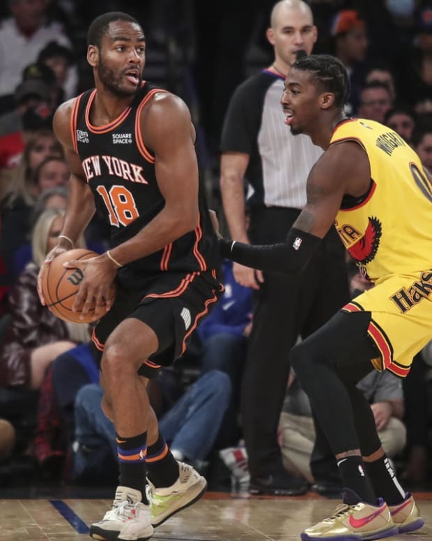 Dec 25, 2021; New York, New York, USA; New York Knicks guard Alec Burks (18) is guarded by Atlanta Hawks guard Delon Wright (0) in the second quarter at Madison Square Garden. Mandatory Credit: Wendell Cruz-USA TODAY Sports