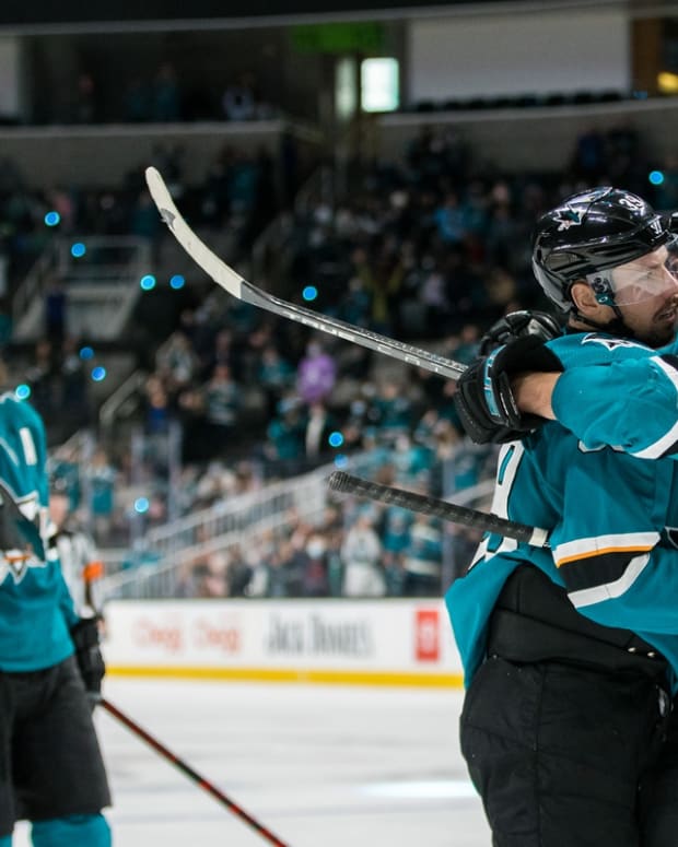 Dec 28, 2021; San Jose, California, USA; San Jose Sharks right wing Timo Meier (28) celebrates with center Logan Couture (39) after strong a goal against the Arizona Coyotes during the second period at SAP Center at San Jose. Mandatory Credit: John Hefti-USA TODAY Sports