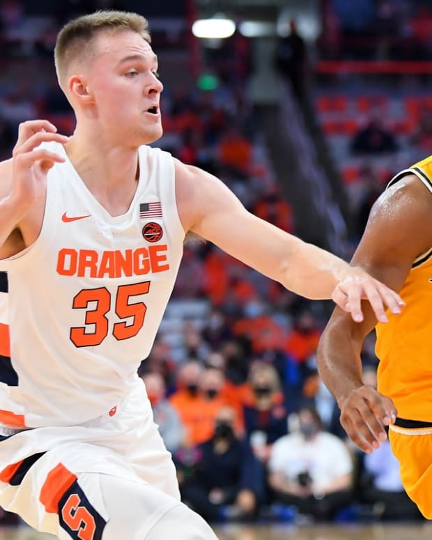 Nov 14, 2021; Syracuse, New York, USA; Drexel Dragons guard Camren Wynter (11) drives to the basket against the defense of Syracuse Orange guard Buddy Boeheim (35) during the first half at the Carrier Dome. Mandatory Credit: Rich Barnes-USA TODAY Sports
