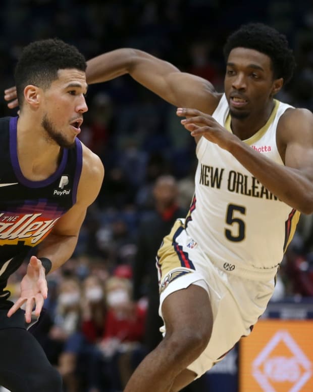 Jan 4, 2022; New Orleans, Louisiana, USA; Phoenix Suns guard Devin Booker (1) is defended by New Orleans Pelicans forward Herbert Jones (5) in the second half at the Smoothie King Center. Mandatory Credit: Chuck Cook-USA TODAY Sports