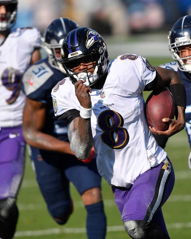 Baltimore Ravens quarterback Lamar Jackson (8) runs for a touchdown during their 20-13 victory over the Tennessee Titans in the AFC Wild Card game at Nissan Stadium in Nashville Jan. 10, 2021.

Titans Ravens 111