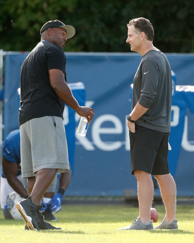 Former Indianapolis Colts defensive end Dwight Freeney talks to the Colts defensive coordinator Matt Eberflus following their preseason training camp practice at Grand Park in Westfield on Saturday, August 10, 2019. Colts Preseason Training Camp