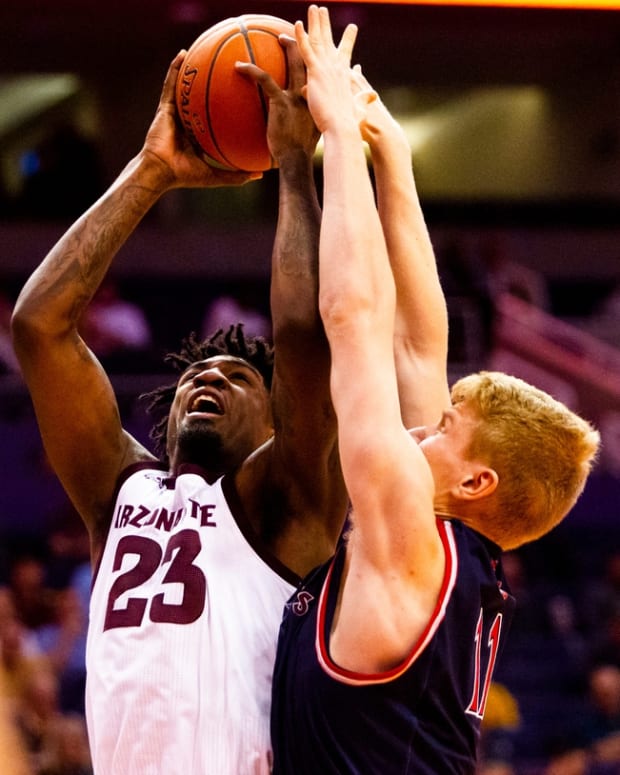Arizona State Sun Devils forward Romello White (23) shoots the ball as Saint Mary's Gaels forward/center Matthias Tass attempts to block him during an NCAA basketball game between Arizona State and Saint Mary's College on Wednesday, Dec. 18, 2019 at Talking Stick Resort Arena in Phoenix.

Cent02 78gtpcpj2k3gantefrw Original