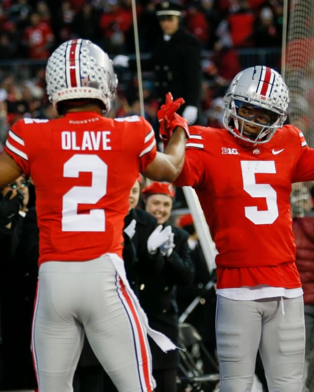 Ohio State wide receivers Garrett Wilson and Chris Olave celebrate touchdown