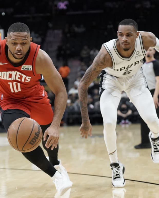 Jan 12, 2022; San Antonio, Texas, USA; Houston Rockets guard Eric Gordon (10) and San Antonio Spurs guard Dejounte Murray (5) go after a loose ball during the first half at AT&amp;T Center. Mandatory Credit: Scott Wachter-USA TODAY Sports