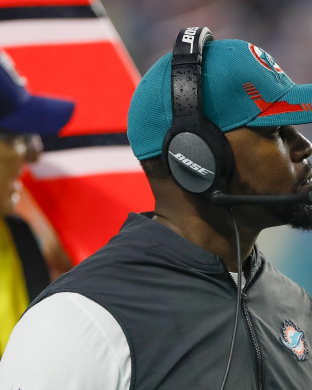 Jan 9, 2022; Miami Gardens, Florida, USA; Miami Dolphins head coach Brian Flores watches from the sideline during the second quarter against the New England Patriots at Hard Rock Stadium.