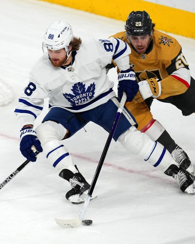 Jan 11, 2022; Las Vegas, Nevada, USA; Toronto Maple Leafs right wing William Nylander (88) skates ahead of Vegas Golden Knights center Chandler Stephenson (20) during an overtime period at T-Mobile Arena. Mandatory Credit: Stephen R. Sylvanie-USA TODAY Sports