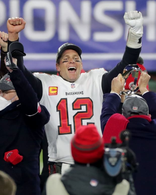 Tampa Bay Buccaneers quarterback Tom Brady (12) exalts during the presentation off the George Halas Trophy after their NFC Championship game Sunday, January 24, 2021 at Lambeau Field in Green Bay, Wis. The Tampa Bay Buccaneers beat the Green Bay Packers 31-26.

Mjs Packers25 24 Hoffman Jpg Packers25