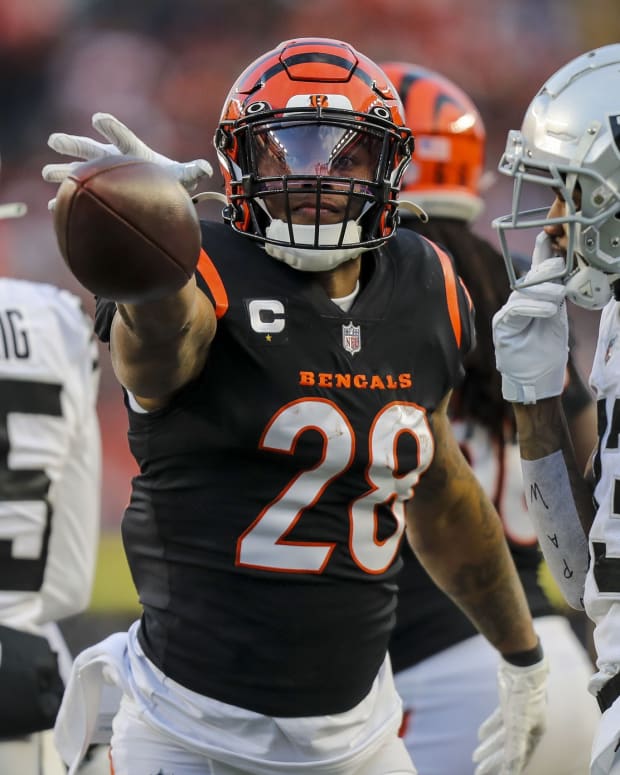 Jan 15, 2022; Cincinnati, Ohio, USA; Cincinnati Bengals running back Joe Mixon (28) reacts after moving the ball forward against the Las Vegas Raiders in the first half in an AFC Wild Card playoff football game at Paul Brown Stadium. Mandatory Credit: Katie Stratman-USA TODAY Sports