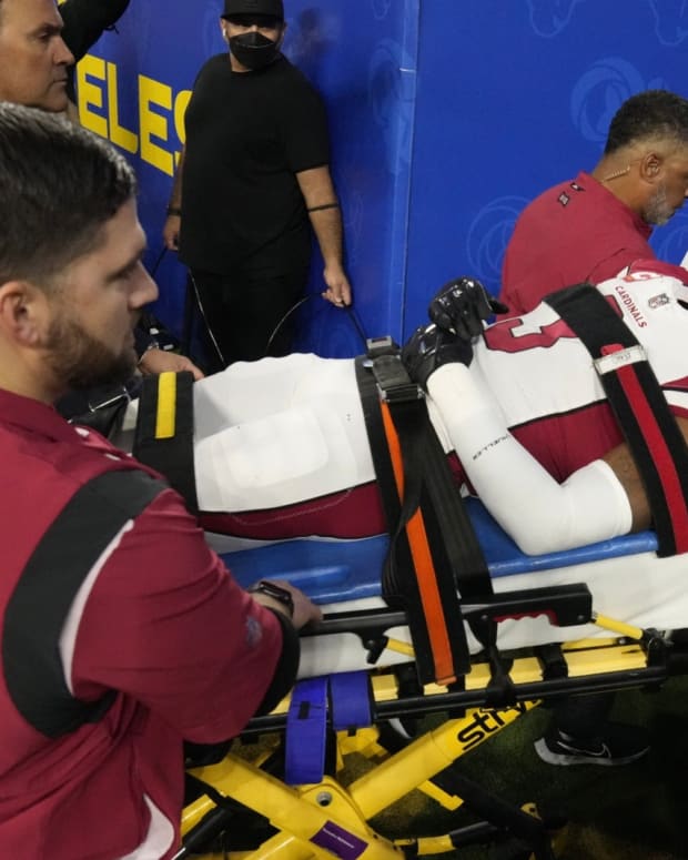 Budda Baker is taken off the field on Monday night after suffering a concussion.