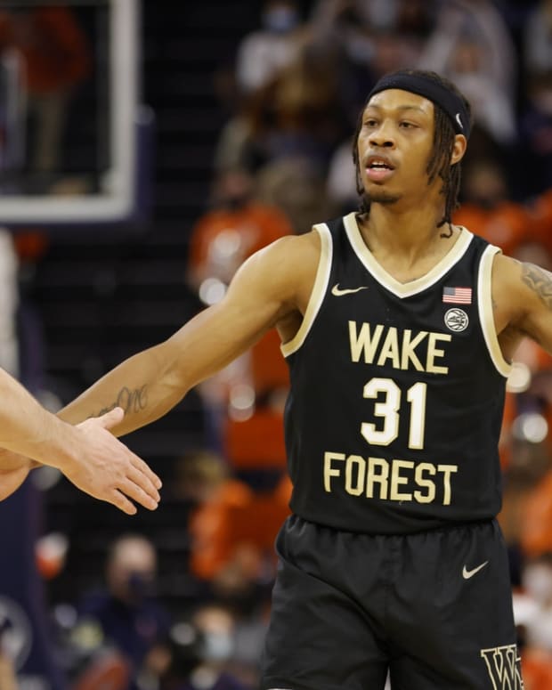 Jan 15, 2022; Charlottesville, Virginia, USA; Wake Forest Demon Deacons guard Alondes Williams (31) celebrates with Demon Deacons forward Jake LaRavia (0) against the Virginia Cavaliers during the second half at John Paul Jones Arena. Mandatory Credit: Geoff Burke-USA TODAY Sports