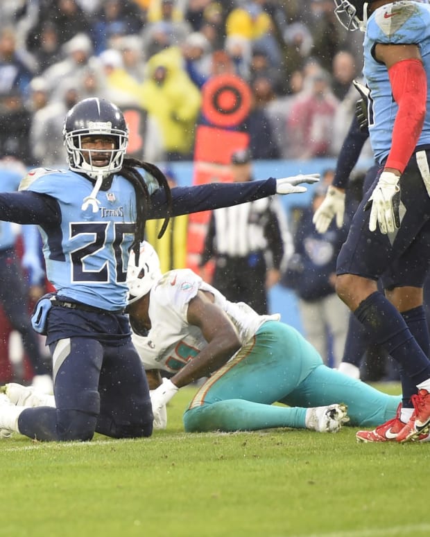 Jan 2, 2022; Nashville, Tennessee, USA; Tennessee Titans cornerback Jack Rabbit Jenkins (20) breaks up a pass thrown to Miami Dolphins wide receiver DeVante Parker (11) during the second half at Nissan Stadium. Mandatory Credit: Steve Roberts-USA TODAY Sports