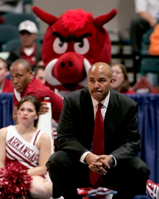 Arkansas Razorbacks head coach Stan Heath watches from the sidelines during the second half of a quarterfinal round SEC Tournament game against the Vanderbilt Commodores at the Georgia Dome in Atlanta.