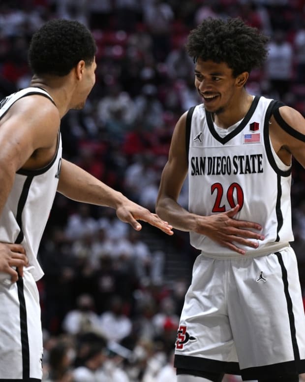 Jan 8, 2022; San Diego, California, USA; San Diego State Aztecs guard Matt Bradley (left) and forward Chad Baker (20) celebrate after a play during the second half against the Colorado State Rams at Viejas Arena. Mandatory Credit: Orlando Ramirez-USA TODAY Sports