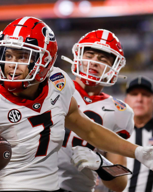 Georgia Bulldogs wide receiver Jermaine Burton (7) celebrates in the end zone after scoring a touchdown against the Michigan Wolverines in the second quarter during the Orange Bowl college football CFP national semifinal game at Hard Rock Stadium.
