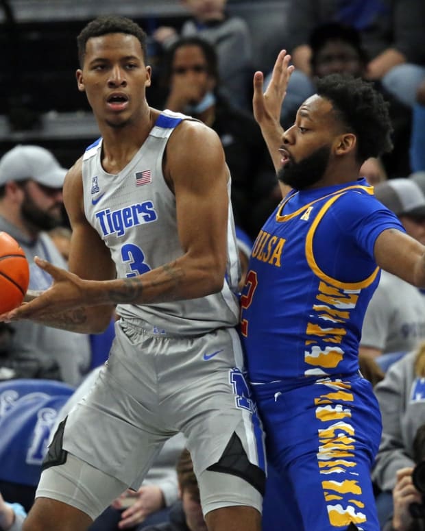 Jan 4, 2022; Memphis, Tennessee, USA; Memphis Tigers guard Landers Nolley II (3) drives to the basket as Tulsa Golden Hurricane guard Keyshawn Embery-Simpson (2) defends during the second half at FedExForum. Mandatory Credit: Petre Thomas-USA TODAY Sports
