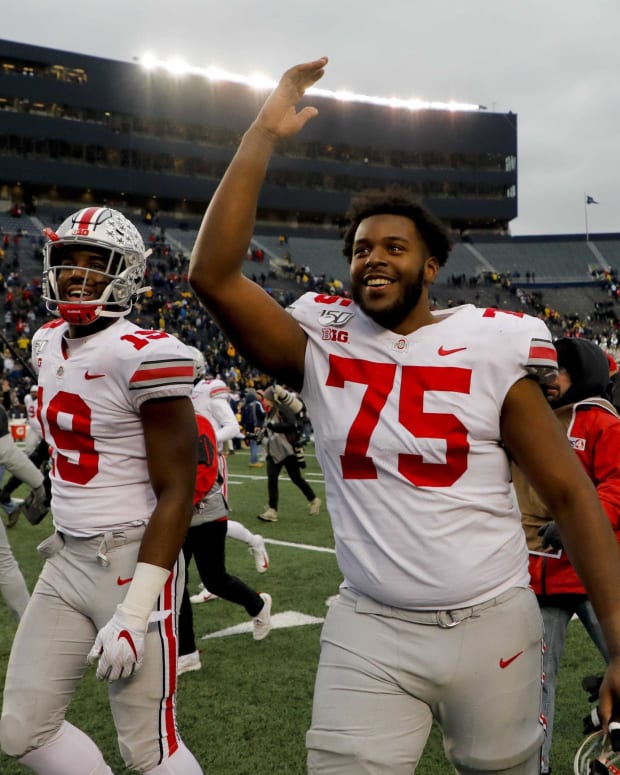 Ohio State left tackle Thayer Munford (75), here celebrating as he leaves the field after a victory at Michigan last season, has blossomed in his third year as a Buckeyes starter.