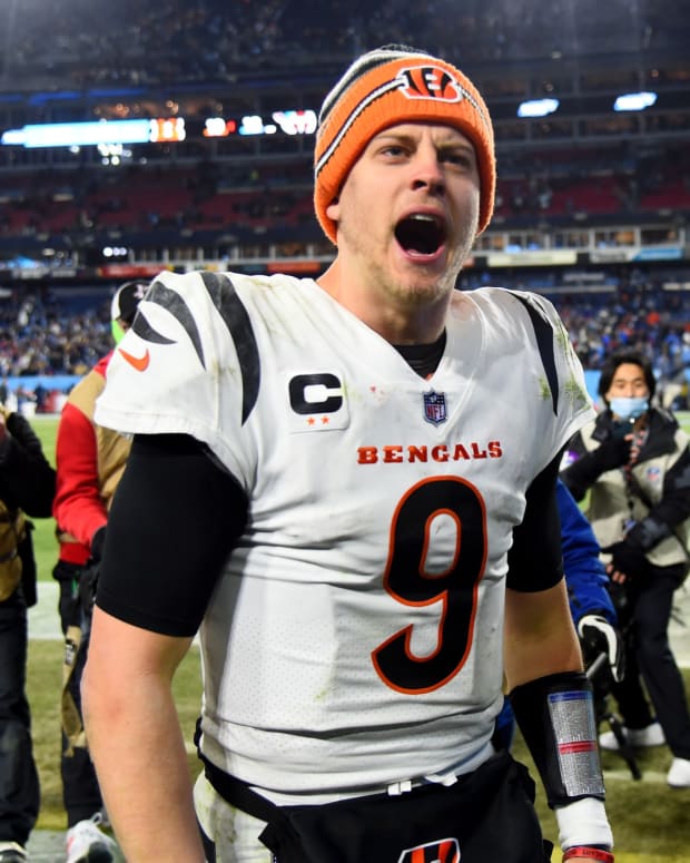 Jan 22, 2022; Nashville, Tennessee, USA; Cincinnati Bengals quarterback Joe Burrow (9) celebrates after the Bengals defeated the Tennessee Titans 19-16 in the AFC Divisional playoff football game at Nissan Stadium. Mandatory Credit: Christopher Hanewinckel-USA TODAY Sports