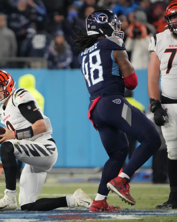 Jan 22, 2022; Nashville, Tennessee, USA; Tennessee Titans outside linebacker Bud Dupree (48) reacts after Cincinnati Bengals quarterback Joe Burrow (9) was sacked during the second half of the AFC Divisional playoff football game at Nissan Stadium. Mandatory Credit: Kirby Lee-USA TODAY Sports