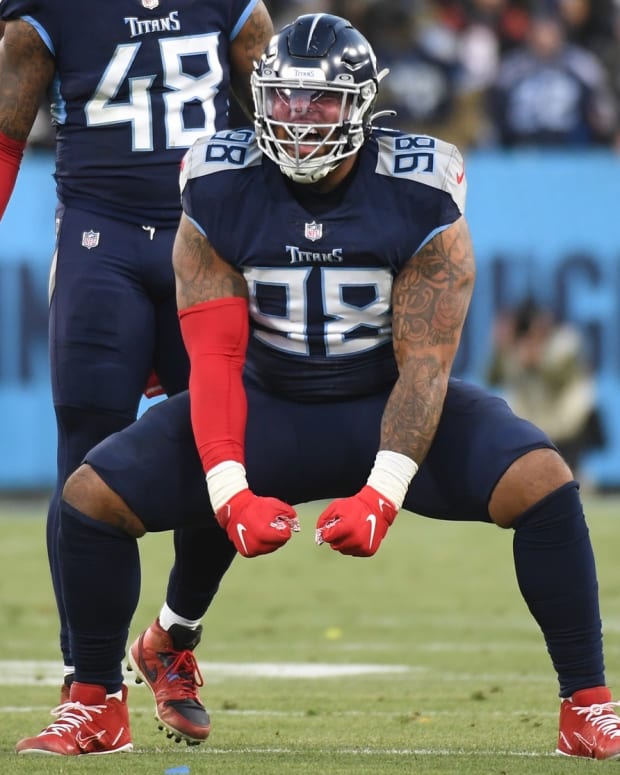 Tennessee Titans defensive end Jeffery Simmons (98) reacts after a play during the first half of an AFC Divisional playoff football game against the Cincinnati Bengals at Nissan Stadium.
