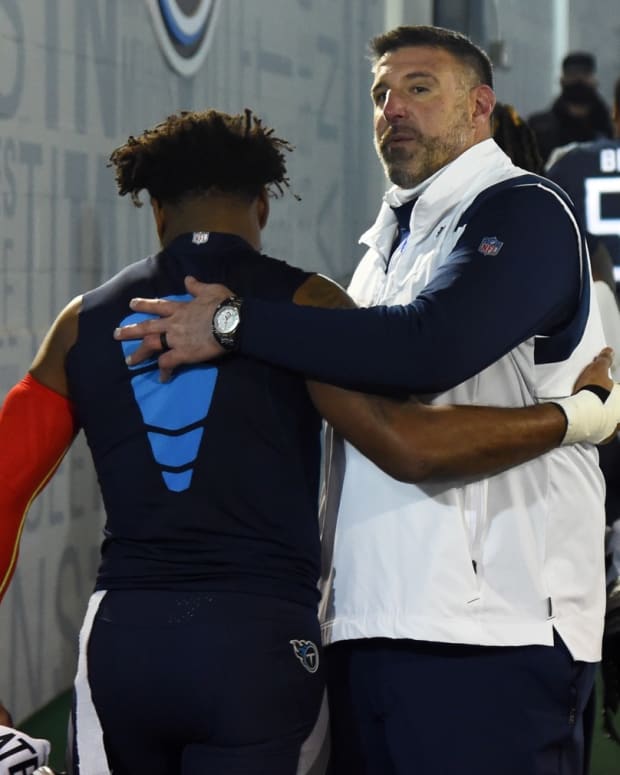 Tennessee Titans free safety Kevin Byard (31) is hugged by Tennessee Titans head coach Mike Vrabel as he leaves the field following a loss against the Cincinnati Bengals during a AFC Divisional playoff football game at Nissan Stadium.