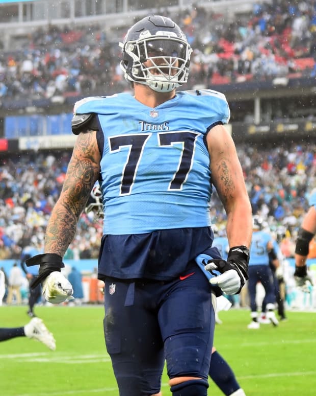 Tennessee Titans offensive tackle Taylor Lewan (77) celebrates after a touchdown during the first half against the Miami Dolphins at Nissan Stadium.