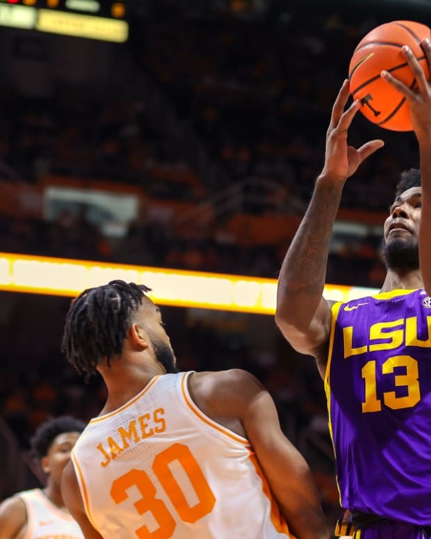 Jan 22, 2022; Knoxville, Tennessee, USA; LSU Tigers forward Tari Eason (13) drives to the basket against Tennessee Volunteers guard Josiah-Jordan James (30) during the first half at Thompson-Boling Arena. Mandatory Credit: Randy Sartin-USA TODAY Sports