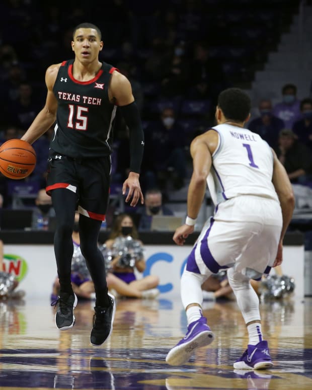 Jan 15, 2022; Manhattan, Kansas, USA; Texas Tech Red Raiders guard Kevin McCullar (15) brings the ball up court against Kansas State Wildcats guard Markquis Nowell (1) during the second half at Bramlage Coliseum.