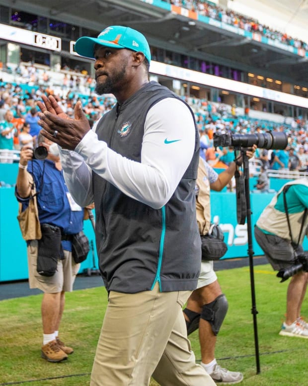 Miami Dolphins head coach Brian Flores, walks off the field after defeating the New York Jets during NFL game at Hard Rock Stadium Sunday in Miami Gardens.