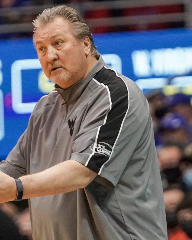 Jan 15, 2022; Lawrence, Kansas, USA; West Virginia Mountaineers head coach Bob Huggins gestures to players against the Kansas Jayhawks during the first half at Allen Fieldhouse.