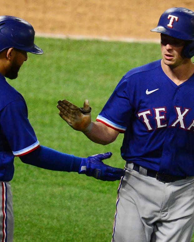 Apr 20, 2021; Anaheim, California, USA; Texas Rangers second baseman Nick Solak (15) is greeted by catcher Jose Trevino (23) after hitting a solo home run against the Los Angeles Angels during the sixth inning at Angel Stadium. Mandatory Credit: Gary A. Vasquez-USA TODAY Sports