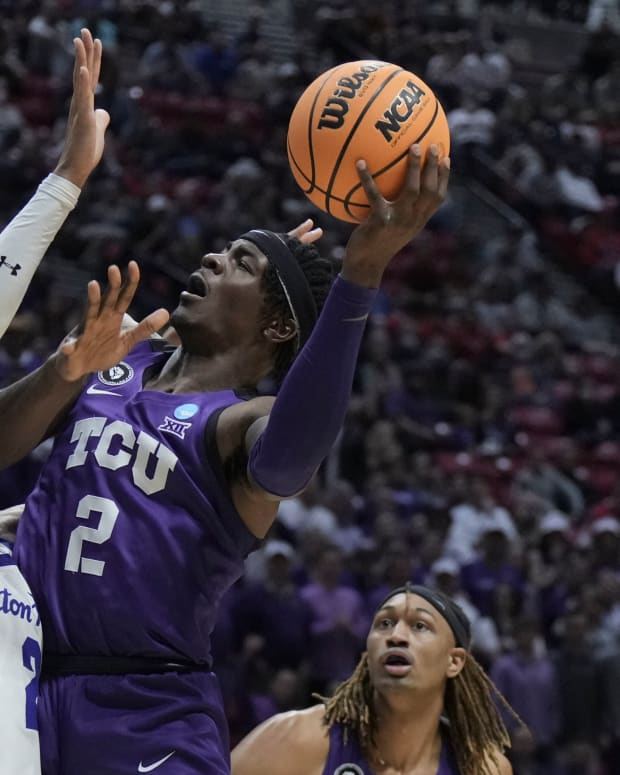 Mar 18, 2022; San Diego, CA, USA; TCU Horned Frogs forward Emanuel Miller (2) shoots the basketball against Seton Hall Pirates forward Tray Jackson (2) during the first half during the first round of the 2022 NCAA Tournament at Viejas Arena.