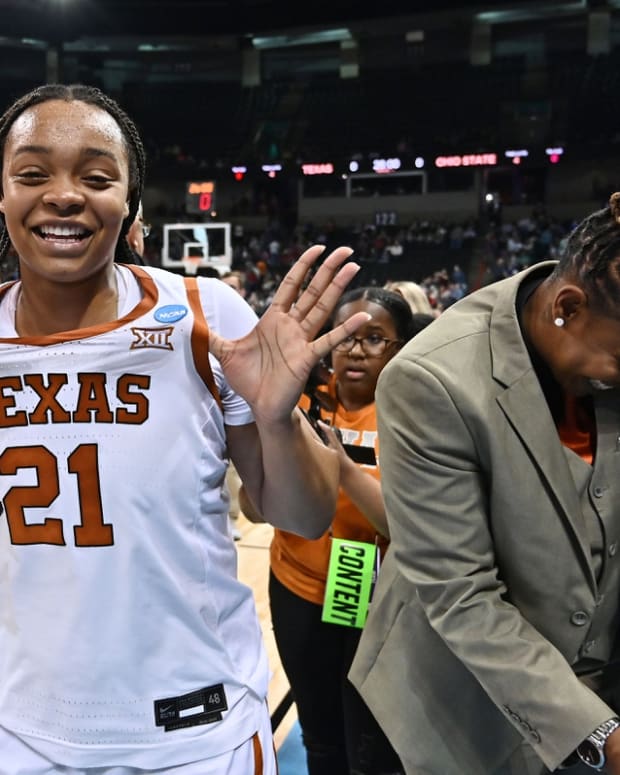 Mar 25, 2022; Spokane, WA, USA; Texas Longhorns forward Aaliyah Moore (21) celebrates after a game against the Ohio State Buckeyes in the Spokane regional semifinals of the women's college basketball NCAA Tournament at Spokane Veterans Memorial Arena. Mandatory Credit: James Snook-USA TODAY Sports