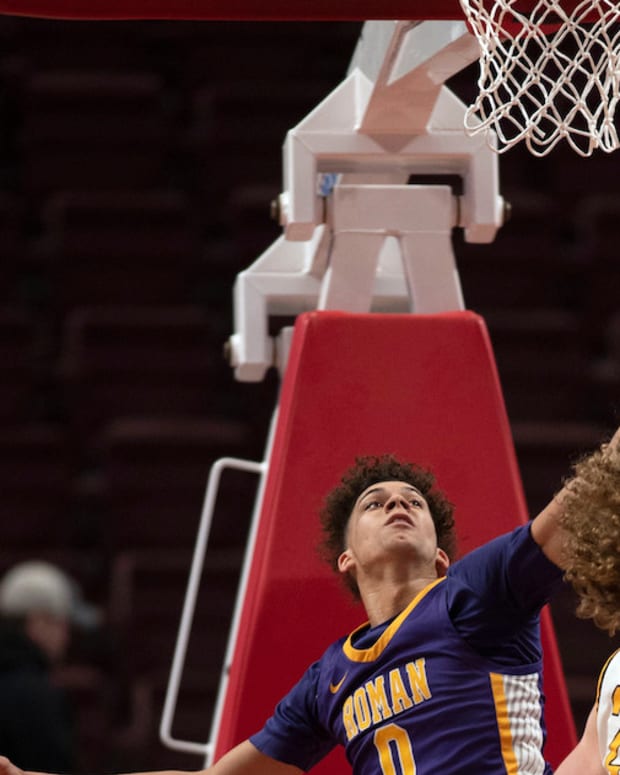 Roman Catholic senior Daniel Skillings jumps to block Archbishop Wood junior Carson Howard at Giant Center in Hershey on Saturday, March 26, 2022. Archbishop Wood boys basketball fell to Roman Catholic in PIAA championship final in class 6A, 77-65.