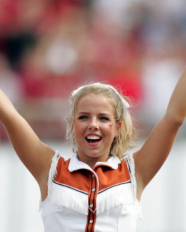 Texas football cheerleaders at a college football game in the Big 12.