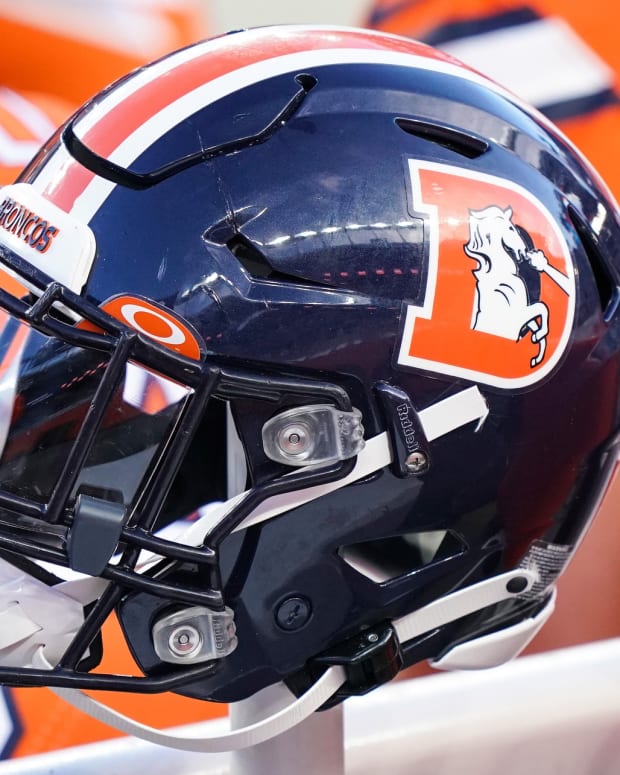 A general view of the Denver Broncos helmet on sidelines against the Buffalo Bills during the second quarter at Empower Field at Mile High.