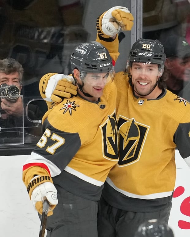 Apr 9, 2022; Las Vegas, Nevada, USA; Vegas Golden Knights left wing Max Pacioretty (67) celebrates with Vegas Golden Knights center Chandler Stephenson (20) after scoring a goal against the Arizona Coyotes during the first period at T-Mobile Arena. Mandatory Credit: Stephen R. Sylvanie-USA TODAY Sports