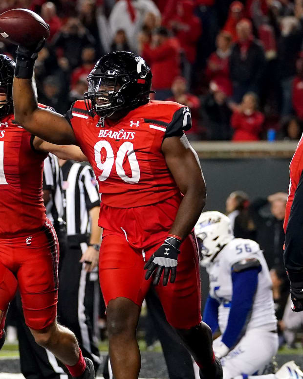 Cincinnati Bearcats defensive lineman Jabari Taylor (90)(90) celebrates after recovering a fumble in the end zone in the fourth quarter during an NCAA football game against the Tulsa Golden Hurricane, Saturday, Nov. 6, 2021, at Nippert Stadium in Cincinnati. The Cincinnati Bearcats won, 28-20. Tulsa Golden Hurricane At Cincinnati Bearcats Nov 6