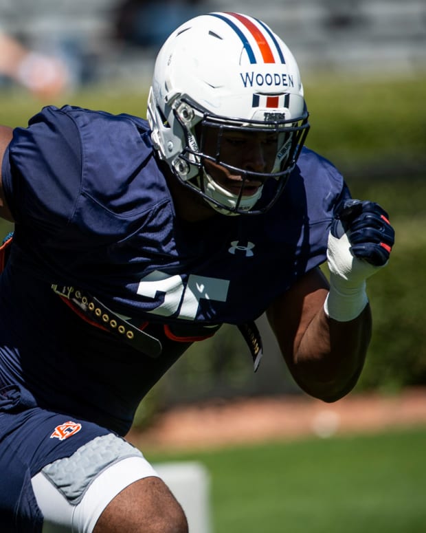 Auburn defensive end Colby Wooden (25) runs drills during an open football practice at Jordan-Hare Stadium in Auburn, Ala., on Saturday, March 20, 2021.