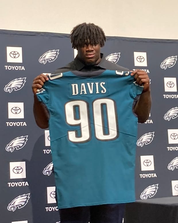 Jordan Davis displays his jersey after being picked 13th overall in the 2022 NFL Draft