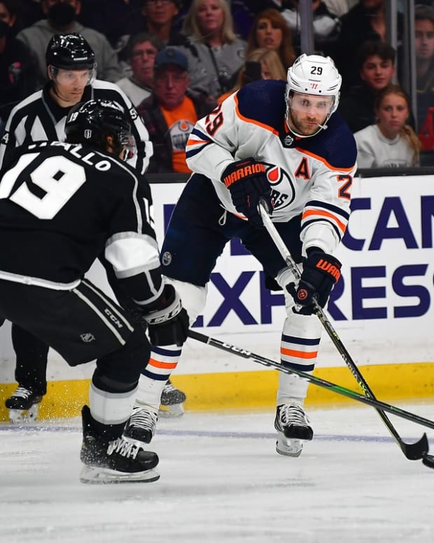 May 8, 2022; Los Angeles, California, USA; Edmonton Oilers center Leon Draisaitl (29) controls the puck against Los Angeles Kings left wing Alex Iafallo (19) during the third period in game four of the first round of the 2022 Stanley Cup Playoffs at Crypto.com Arena. Mandatory Credit: Gary A. Vasquez-USA TODAY Sports