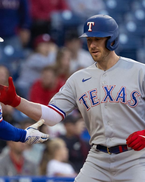 May 3, 2022; Philadelphia, Pennsylvania, USA; Texas Rangers catcher Mitch Garver (18) celebrates with right fielder Adolis Garcia (53) after hitting a two RBI home run during the first inning against the Philadelphia Phillies at Citizens Bank Park.