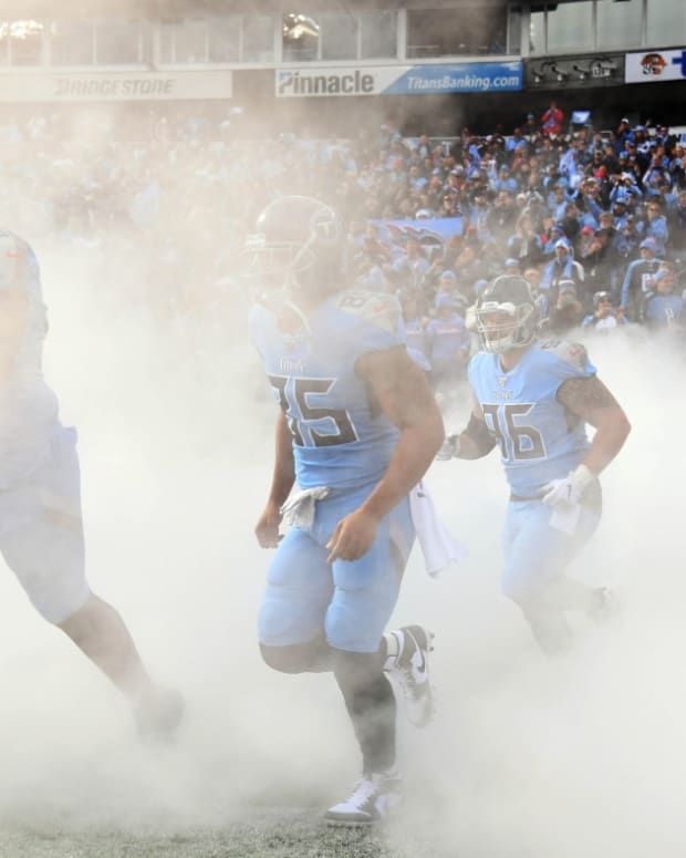 Tennessee Titans players take the field during player introductions before the game against the Houston Texans at Nissan Stadium.
