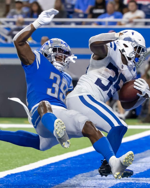 Aug 27, 2021; Detroit, Michigan, USA; Indianapolis Colts running back Deon Jackson (35) fights off a tackle from Detroit Lions cornerback Jerry Jacobs (39) and scores a touchdown in the fourth quarter at Ford Field.