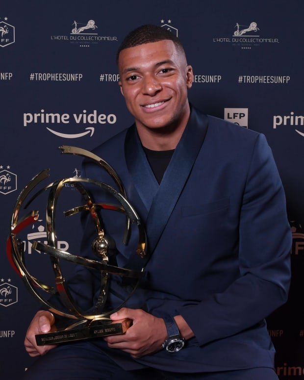 Kylian Mbappe pictured with his trophy after being named as the 2021/22 Ligue 1 Player of the Season