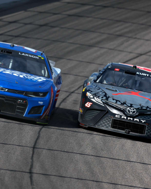 Kurt Busch (right) passes Austin Cindric en route to Sunday win in the AdventHealth 400 NASCAR Cup race at Kansas Speedway. (Photo by Sean Gardner/Getty Images)
