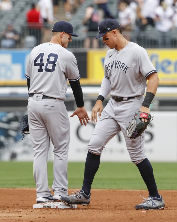New York Yankees 1B Anthony Rizzo celebrates win with RF Aaron Judge
