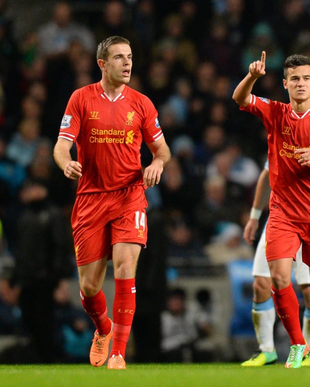 Philippe Coutinho (right) pictured celebrating after scoring for Liverpool against Manchester City at the Etihad Stadium in 2013